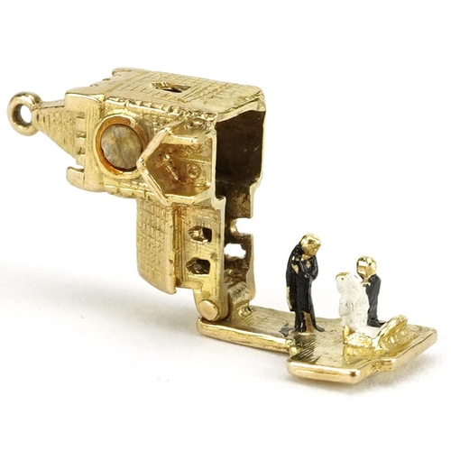 2208 - 9ct gold church charm opening to reveal enamelled bride and groom, 1.7cm high, 3.5g