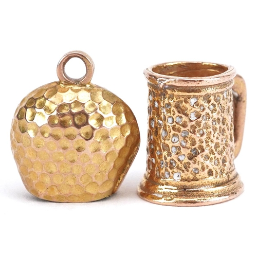 2689 - Two gold charms comprising 9ct gold tankard and unmarked gold cattle bell, the largest 11mm high, to... 