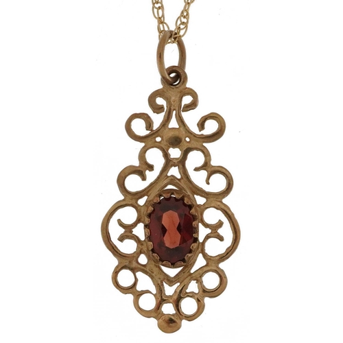 2793 - 9ct gold garnet openwork pendant on a 9ct gold necklace, 2.5cm high and 48cm in length, 1.6g