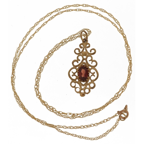 2793 - 9ct gold garnet openwork pendant on a 9ct gold necklace, 2.5cm high and 48cm in length, 1.6g