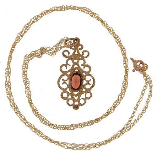 2793 - 9ct gold garnet openwork pendant on a 9ct gold necklace, 2.5cm high and 48cm in length, 1.6g