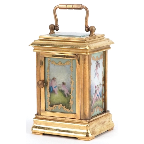 250 - Miniature brass cased carriage clock with swing handle and Sevres style panels hand painted with Put... 