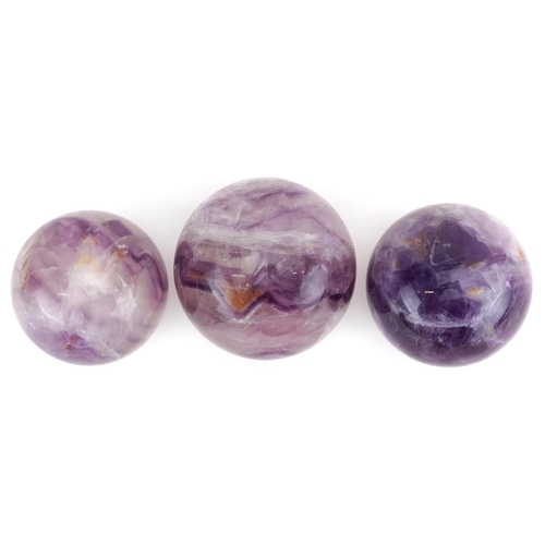 245 - Three polished fluorite spheres, the largest 6.5cm in diameter