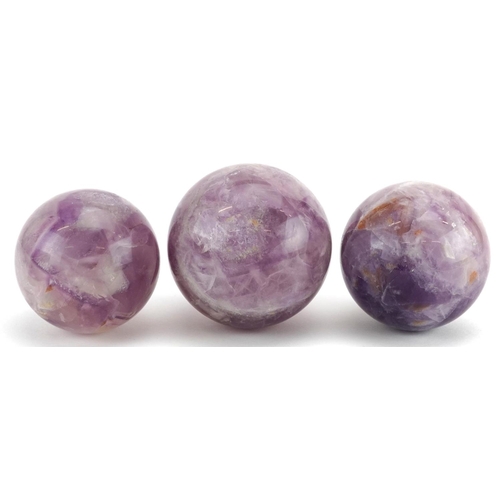 245 - Three polished fluorite spheres, the largest 6.5cm in diameter