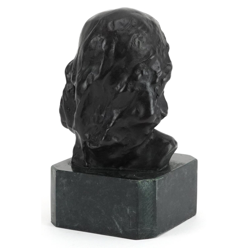 1183 - Patinated bronze head and shoulders bust of a young female raised on a green marble base, 15cm high