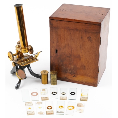 104 - Victorian lacquered brass adjustable student's microscope with prepared slides housed in a fitted ma... 