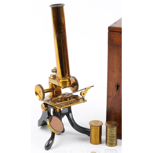 104 - Victorian lacquered brass adjustable student's microscope with prepared slides housed in a fitted ma... 