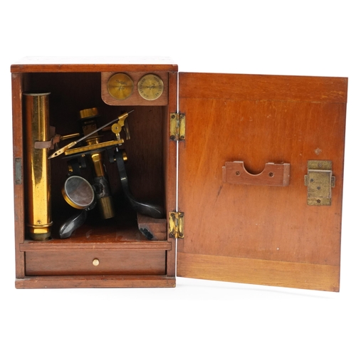 104 - Victorian lacquered brass adjustable student's microscope with prepared slides housed in a fitted ma... 