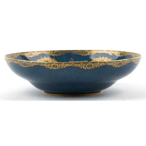 1192 - Royal Worcester porcelain centre bowl gilded with trees, numbered 2577 to the base, 31.5cm in diamet... 