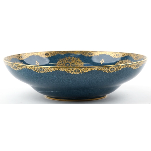 1192 - Royal Worcester porcelain centre bowl gilded with trees, numbered 2577 to the base, 31.5cm in diamet... 