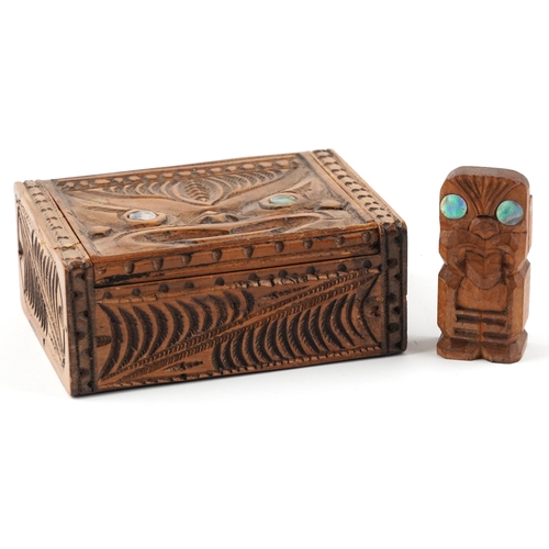 327 - New Zealand Maori carvings including a rectangular box with hinged lid and abalone inlay, the larges... 