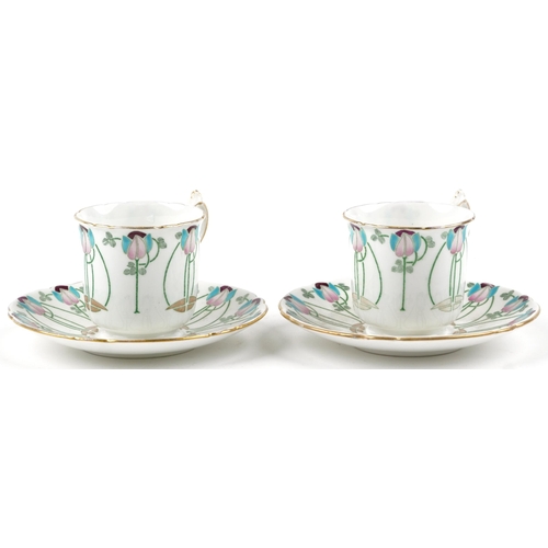 325 - Foley Wileman, two Art Nouveau cups with saucers hand painted and decorated with stylised flowers, t... 