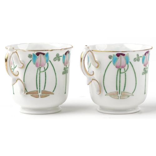 325 - Foley Wileman, two Art Nouveau cups with saucers hand painted and decorated with stylised flowers, t... 