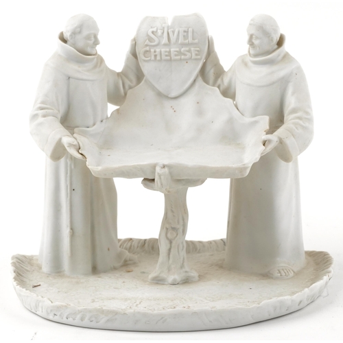 288 - St Ivel Cheese advertising parianware stand in the form of two monks holding a shield and tray, 19.5... 