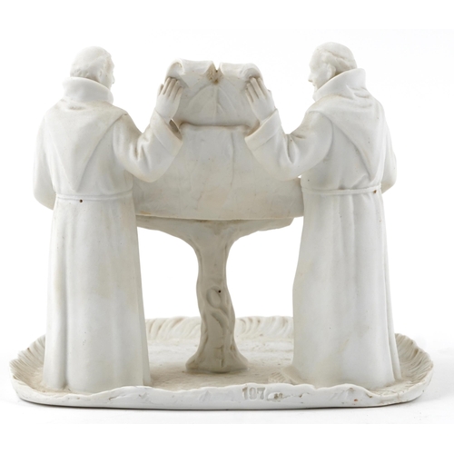 288 - St Ivel Cheese advertising parianware stand in the form of two monks holding a shield and tray, 19.5... 