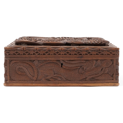 1216 - Chinese hardwood jewellery chest having lift out interior and hinged lid deeply carved a dragon, 12c... 