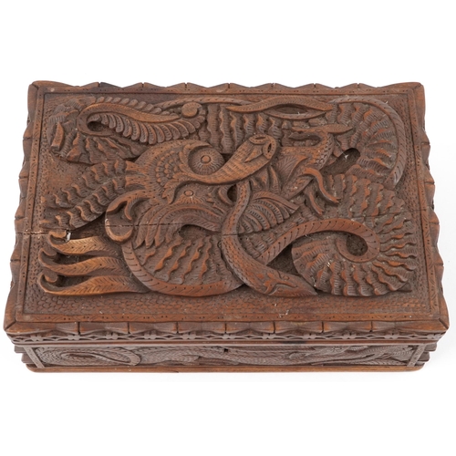 1216 - Chinese hardwood jewellery chest having lift out interior and hinged lid deeply carved a dragon, 12c... 