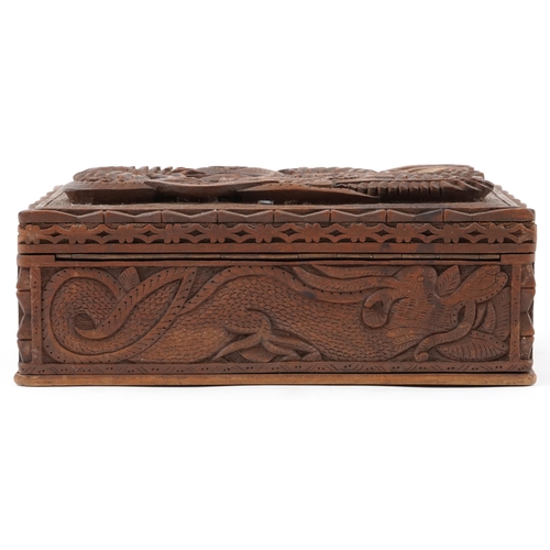 1216 - Chinese hardwood jewellery chest having lift out interior and hinged lid deeply carved a dragon, 12c... 