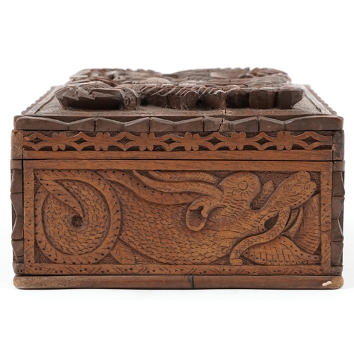 1216 - Chinese hardwood jewellery chest having lift out interior and hinged lid deeply carved a dragon, 12c... 