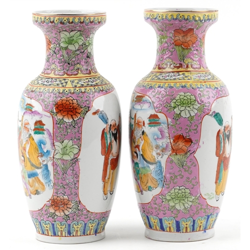 1122 - Pair of Chinese porcelain vases decorated with figures and flowers, each 37cm high