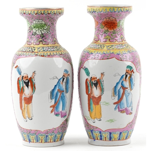 1122 - Pair of Chinese porcelain vases decorated with figures and flowers, each 37cm high