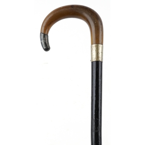 331 - Ebonised walking stick with horn handle and silver mount, the horn handle possibly rhinoceros, 85cm ... 