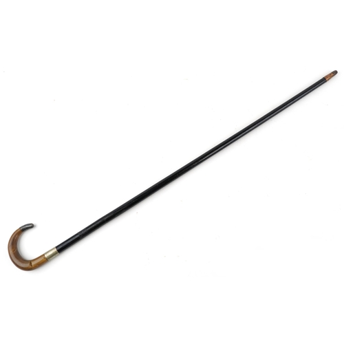 331 - Ebonised walking stick with horn handle and silver mount, the horn handle possibly rhinoceros, 85cm ... 