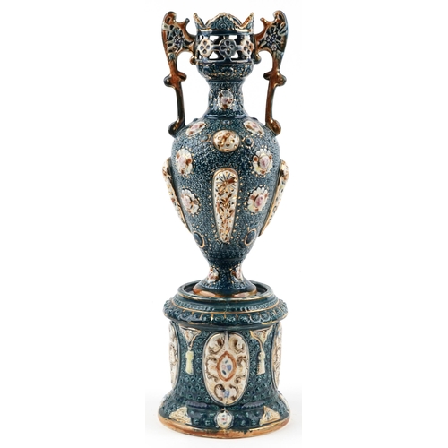 1242 - Continental Maiolica pierced vase with twin handles on a circular base, the vase and base each stamp... 