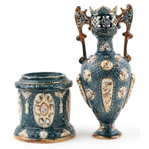 1242 - Continental Maiolica pierced vase with twin handles on a circular base, the vase and base each stamp... 