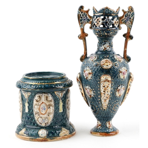 1242 - Continental Maiolica pierced vase with twin handles on a circular base, the vase and base each stamp... 