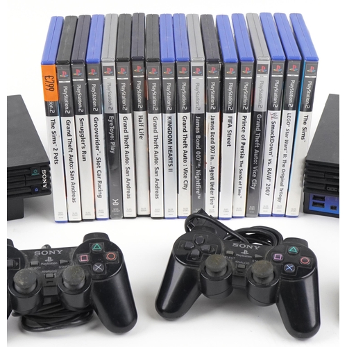 1394 - Two Sony PlayStation 2 games consoles with controllers and a collection of games