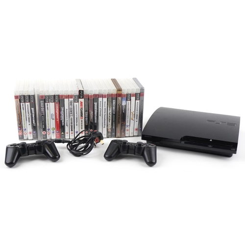 1395 - Sony PlayStation 3 games console with two controllers and a collection of games