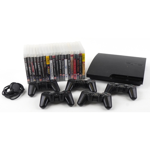 1397 - Sony PlayStation 3 games console with five controllers and a collection of games