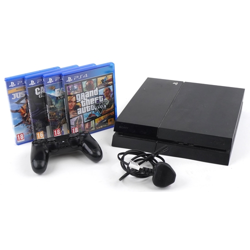 1384 - Sony PlayStation 4 games console with controller and four games including Grand Theft Auto 5 and Cal... 