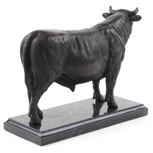 249 - Patinated bronze study of a bull raised on a black marble base, 24cm in length