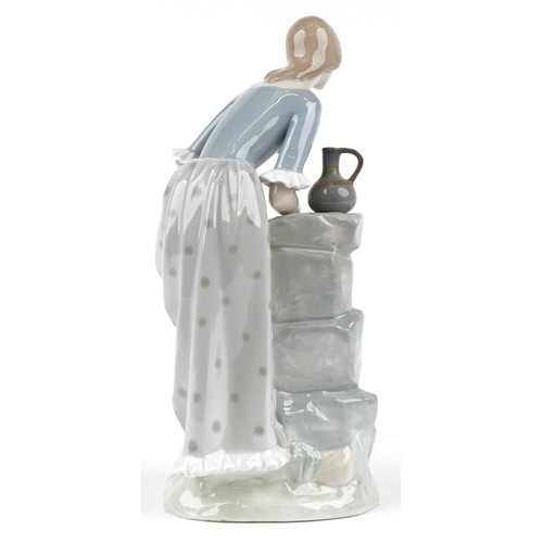 389 - Large Nao figurine of a water carrier, 34cm high