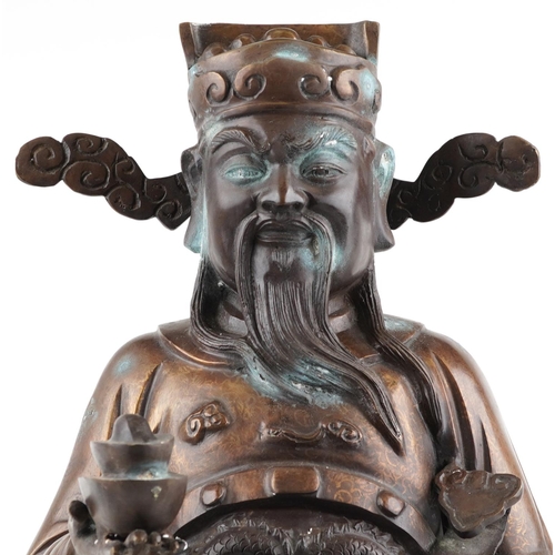 1104 - Large Chinese watered bronze figure of a standing emperor holding a ruyi sceptre, 78cm high