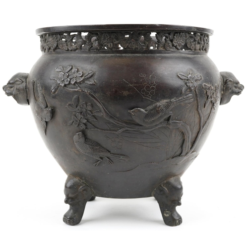 1103 - Japanese patinated bronze four footed jardiniere with pierced border and animalia handles carved in ... 