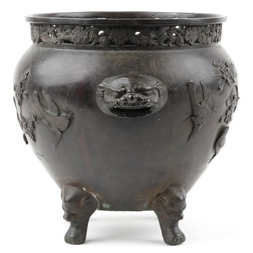 1103 - Japanese patinated bronze four footed jardiniere with pierced border and animalia handles carved in ... 