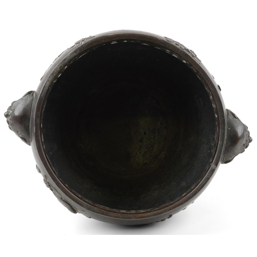 1103 - Japanese patinated bronze four footed jardiniere with pierced border and animalia handles carved in ... 