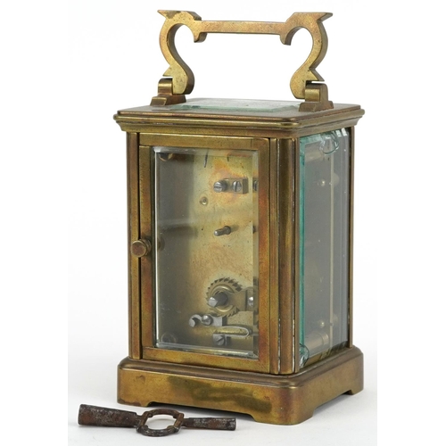 232 - French brass cased carriage clock with enamelled dial having Roman numerals, 11cm high