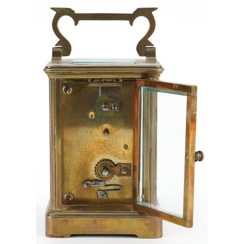 232 - French brass cased carriage clock with enamelled dial having Roman numerals, 11cm high