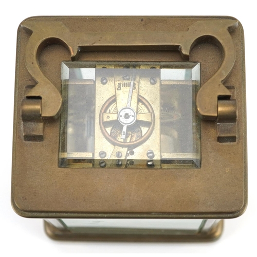 232 - French brass cased carriage clock with enamelled dial having Roman numerals, 11cm high