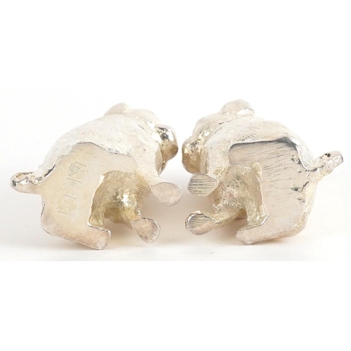 1291 - Pair of novelty silver plated salt and pepper casters in the form of dogs, each 6.5cm high