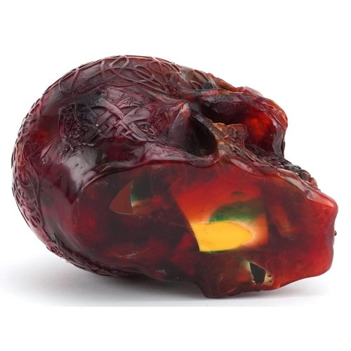 1178 - Large amber style study of a human skull, 13cm high