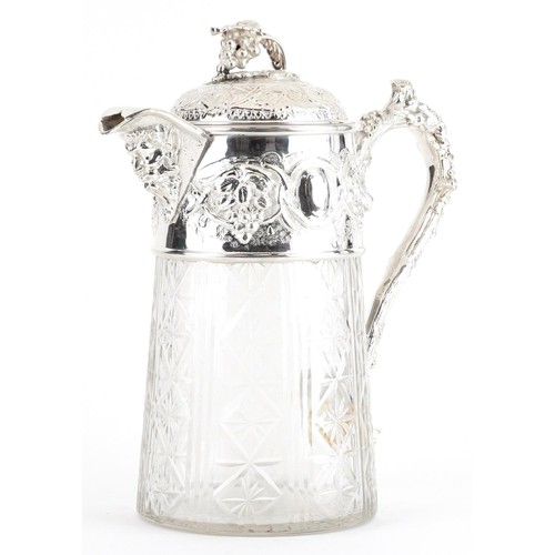 234 - 19th century style glass jug with silver plated mounts decorated in relief with leaves and berries, ... 