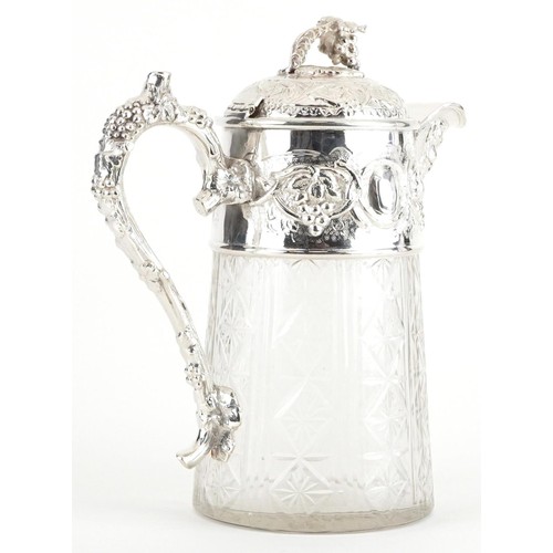 234 - 19th century style glass jug with silver plated mounts decorated in relief with leaves and berries, ... 