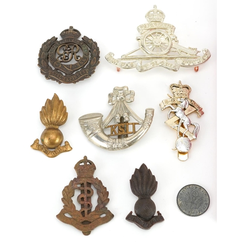 500 - Militaria including Polish Order of the Banner of Work, Cross of Merit Third Class and cap badges