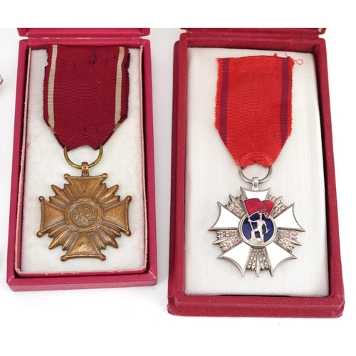 500 - Militaria including Polish Order of the Banner of Work, Cross of Merit Third Class and cap badges