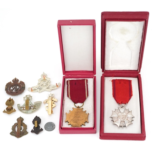 500 - Militaria including Polish Order of the Banner of Work, Cross of Merit Third Class and cap badges